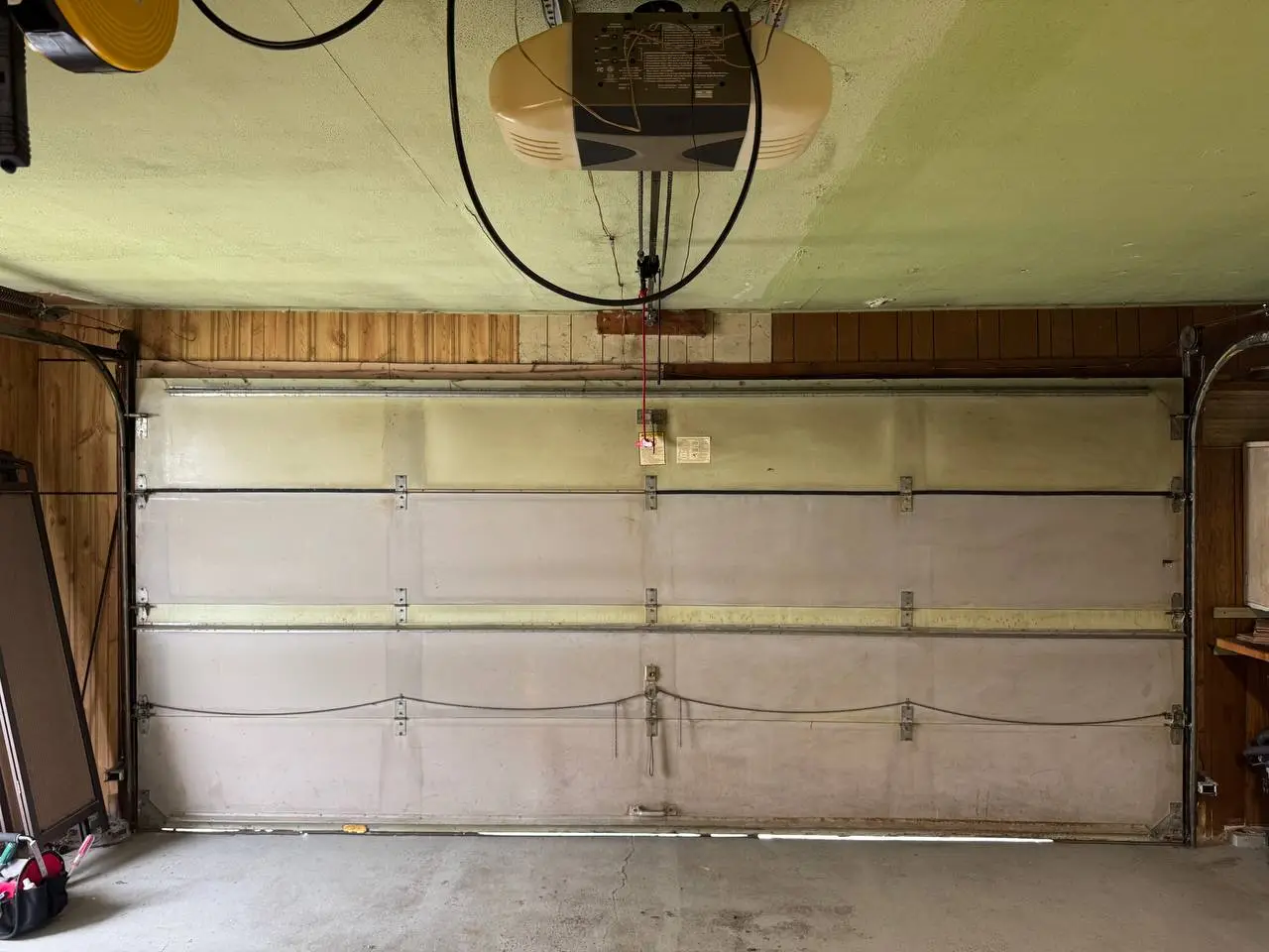Inside view of the old garage door before replacement
